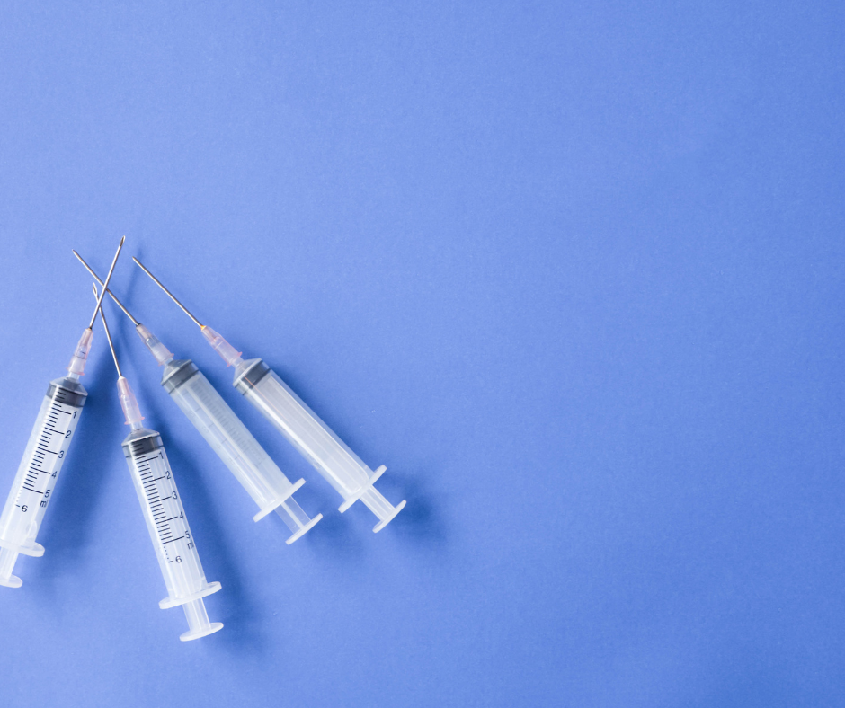4 Needles together on a purple background