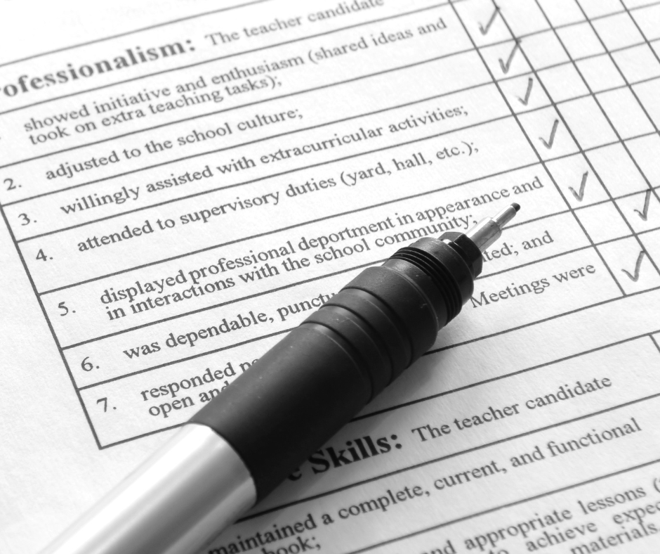 Silver lead pencil with black grip on top of a black and white checklist for proffessionalism.